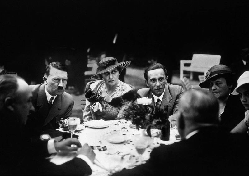 Adolf Hitler with Magda and Joseph Goebbels at a garden party in the garden of the Reichs chancellery